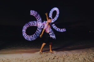 fire crew spinning cayman islands beach portrait long exposure photography