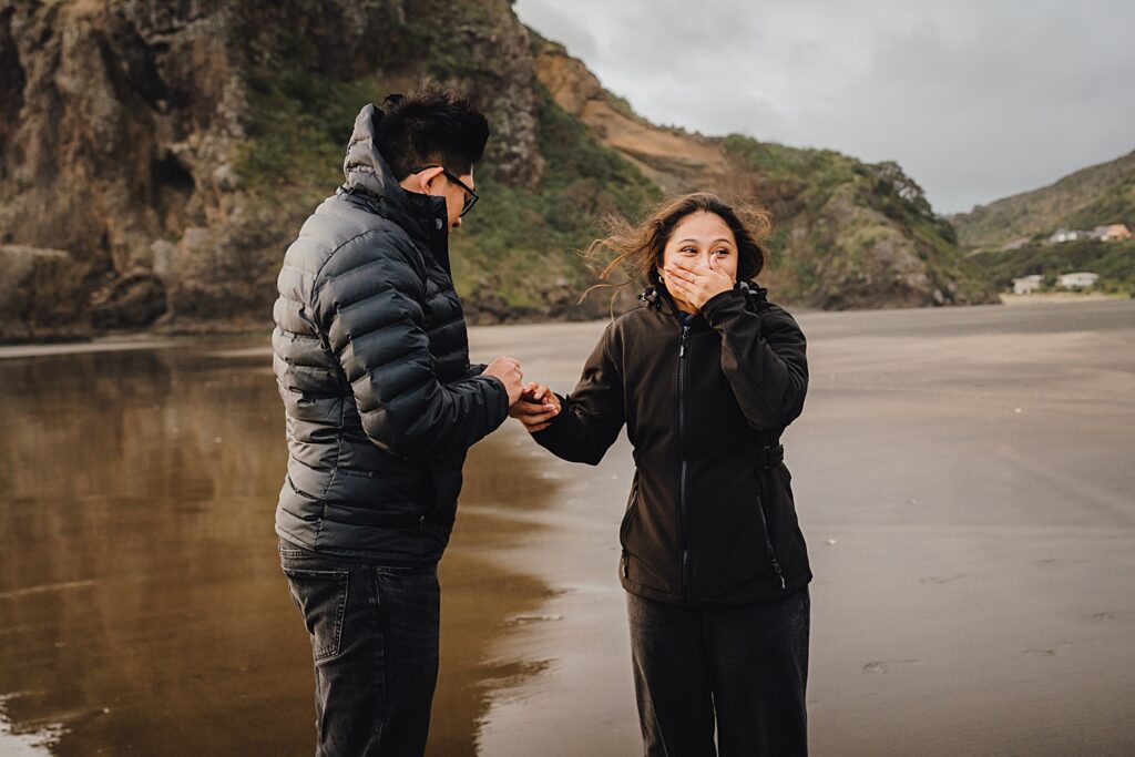 piha beach surprise proposal engagement photographer